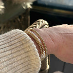 gold wrap bracelet with pearls worn with a cream Isabel Marant jumper