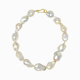 Pearl necklace with a gold clasp on a white background