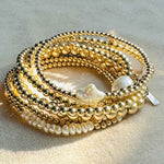 Stack of 14 Karat Gold Filled beaded bracelet with and with our freshwater pearls