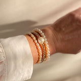 Round Freshwater Pearl and Gold Vermeil Bracelet stacked with other gold and pearl bracelets