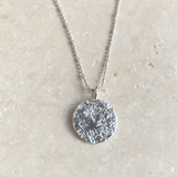 STERLING SILVER NECKLACE WITH SMALL TEXTURED ROUND PENDANT