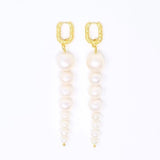 Long Graduated Pearl Earrings with 18k gold plated textured huggies