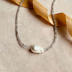 Baroque pearl and labradorite choker laying on a velvet backdrop.jpg