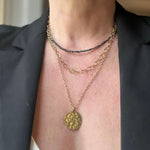Black diamond chip necklace layered with raw gold necklaces