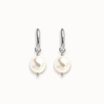 Pearl earrings with silver hooks on a white background