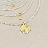 A selection of some of  RAW Copenhagen delicate pearl necklaces with and without pendant