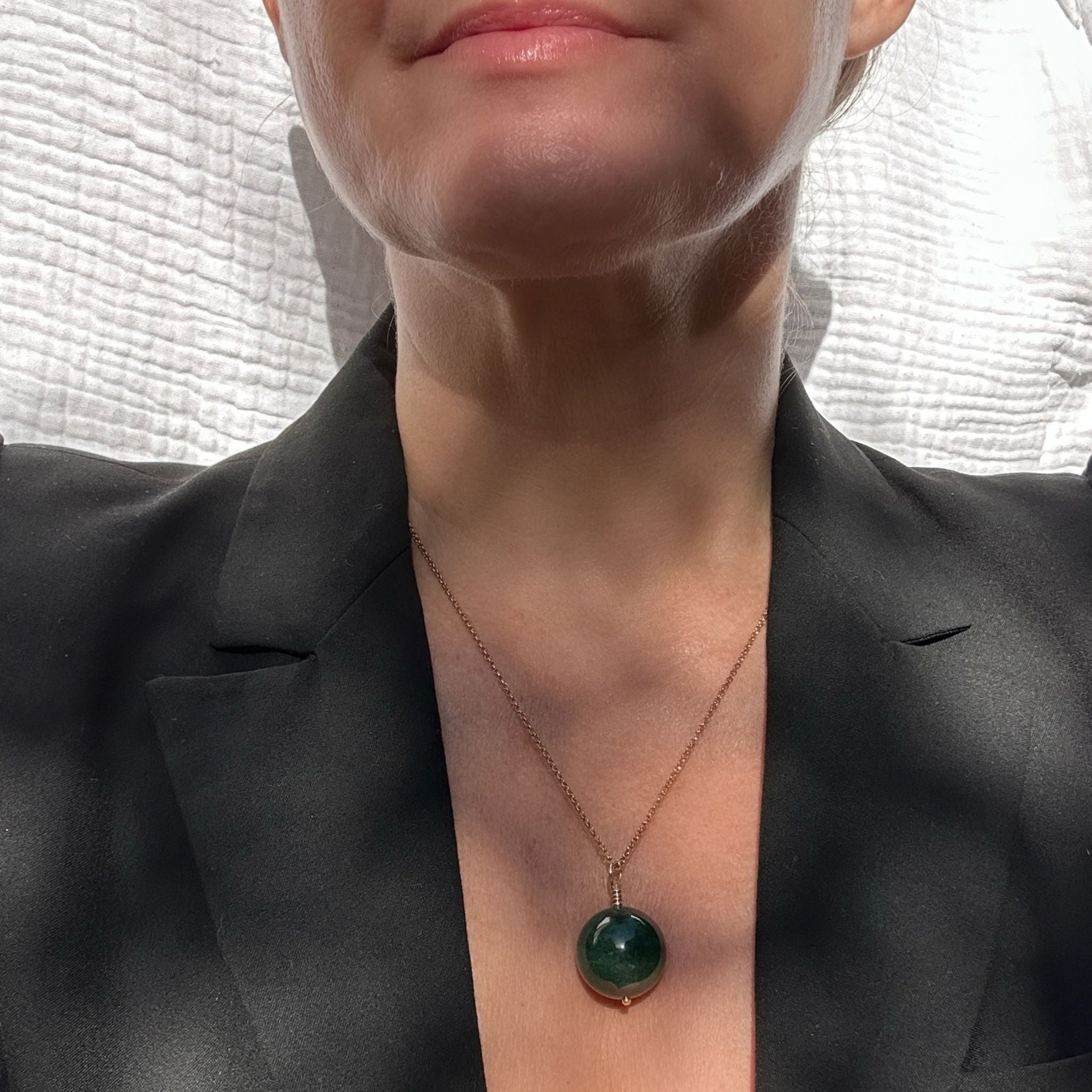 Green onyx  pendant necklace styled with a black blazer