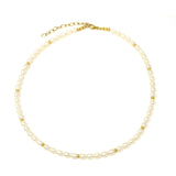 Elegant Pearl Necklace lying flat on a white background made with the highest quality freshwater pearls and 24K gold plated Sterling silver beads 