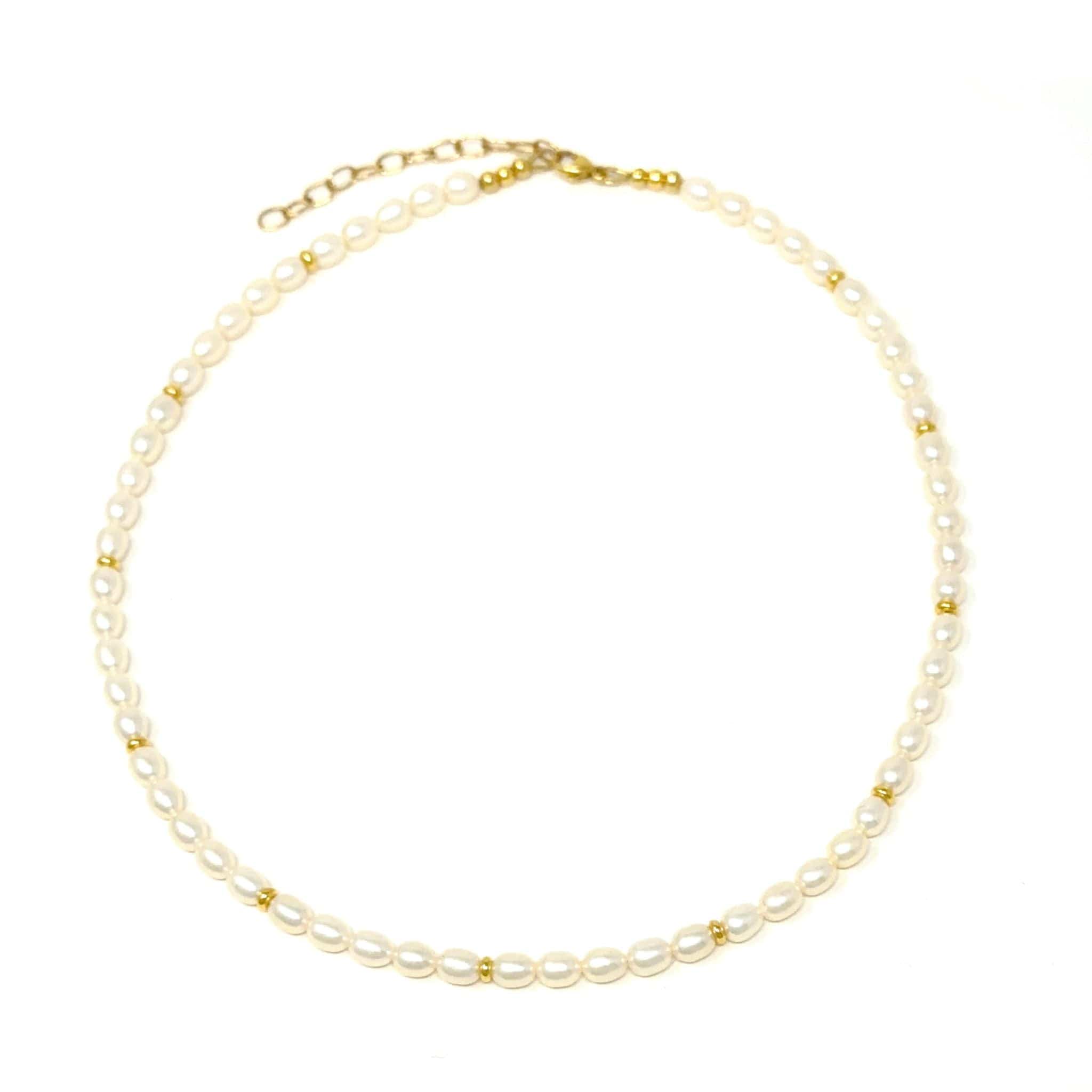 Elegant Pearl Necklace lying flat on a white background made with the highest quality freshwater pearls and 24K gold plated Sterling silver beads 