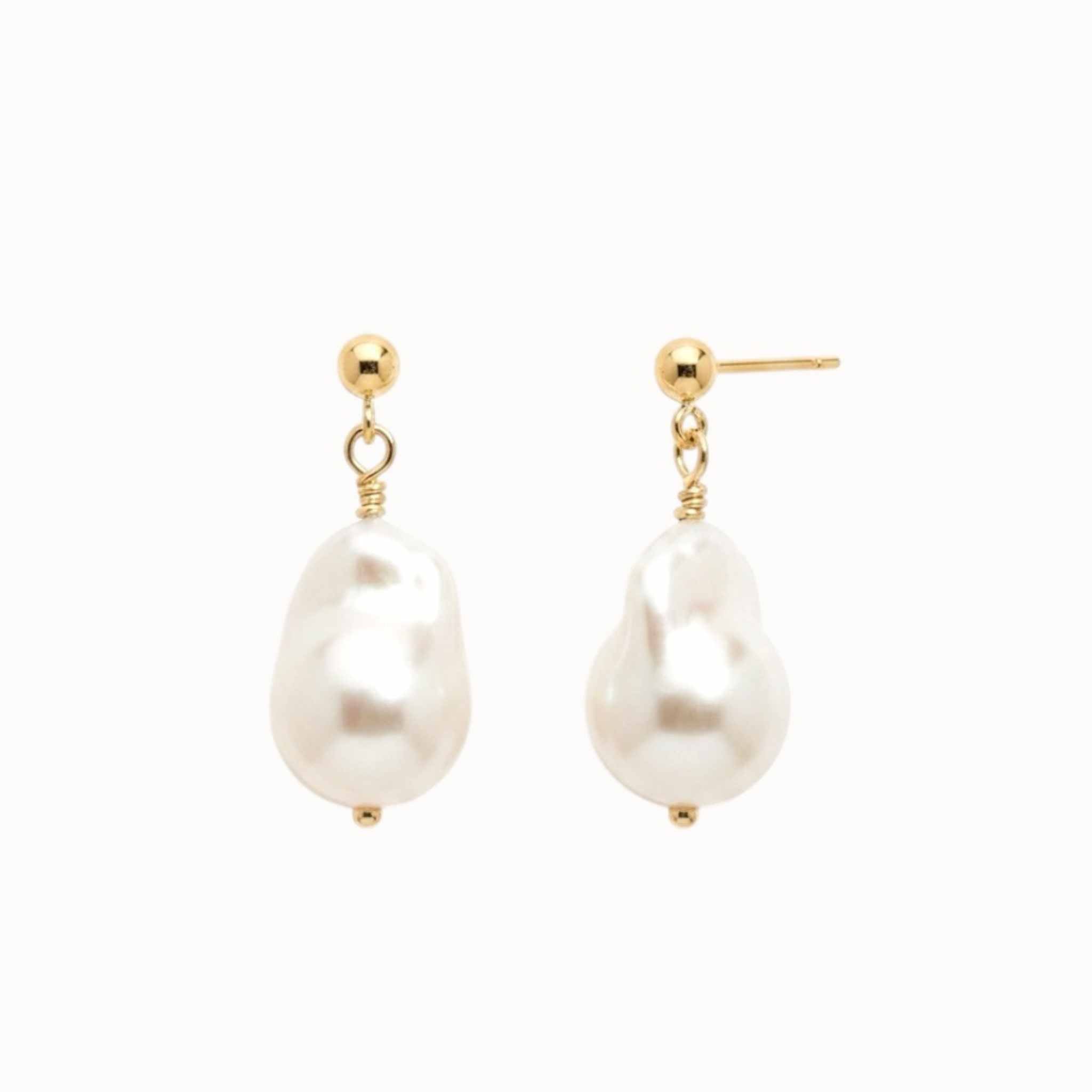 Baroque pearl earrings with gold hooks on a white background