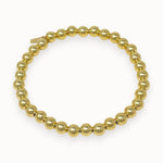 Gold filled beaded bracelet on white background