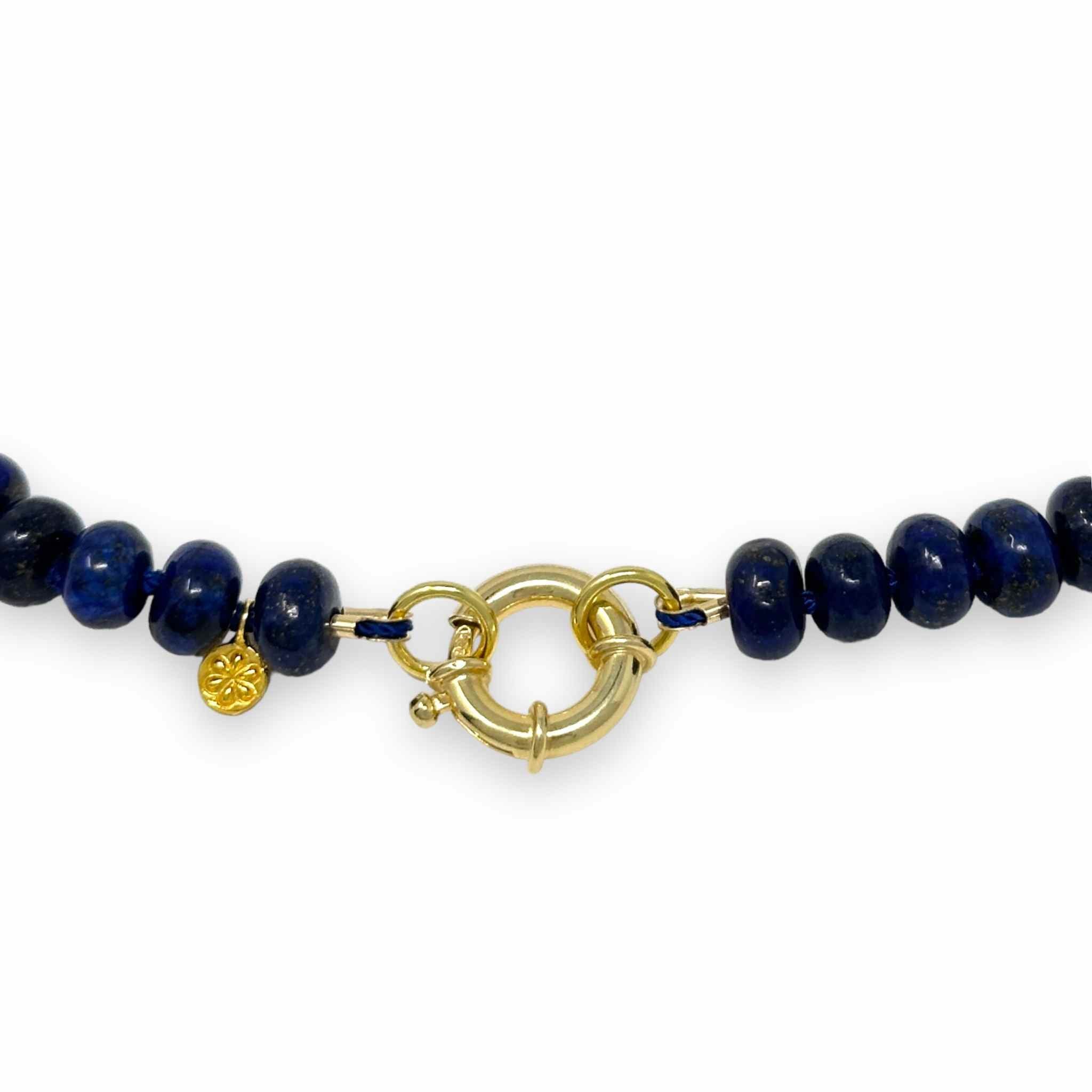 Lapis Lazuli necklace beaded zoomed in on beaded details around clasp against white background