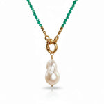 Necklace with green beads and a pearl pendant on a white background