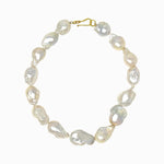 Pearl necklace with a gold clasp on a white background