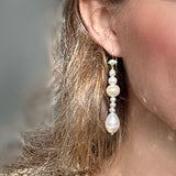 Pearl Drop earrings with different size pearls, longer version modelled