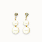 Pair of pearl earrings with gold accents on a white background