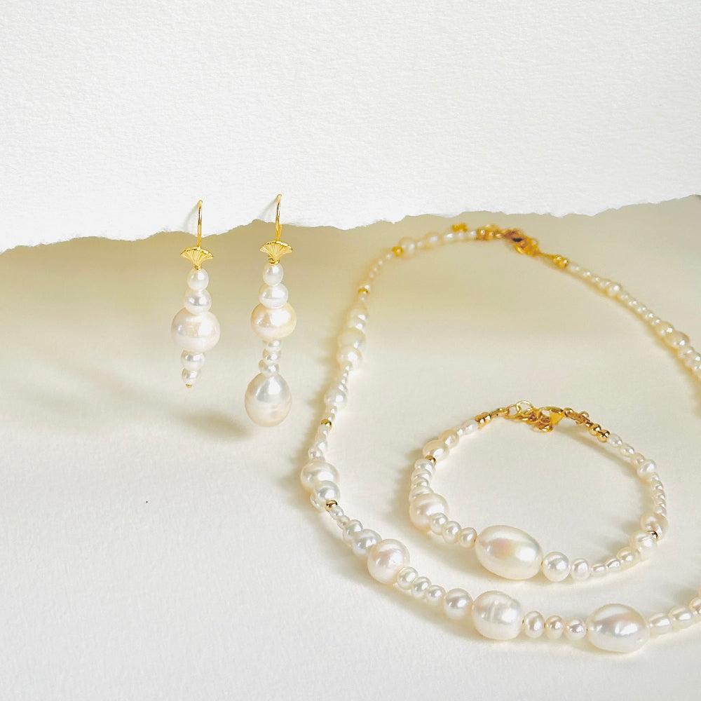 Different size pearl drop earrings, necklace and bracelet