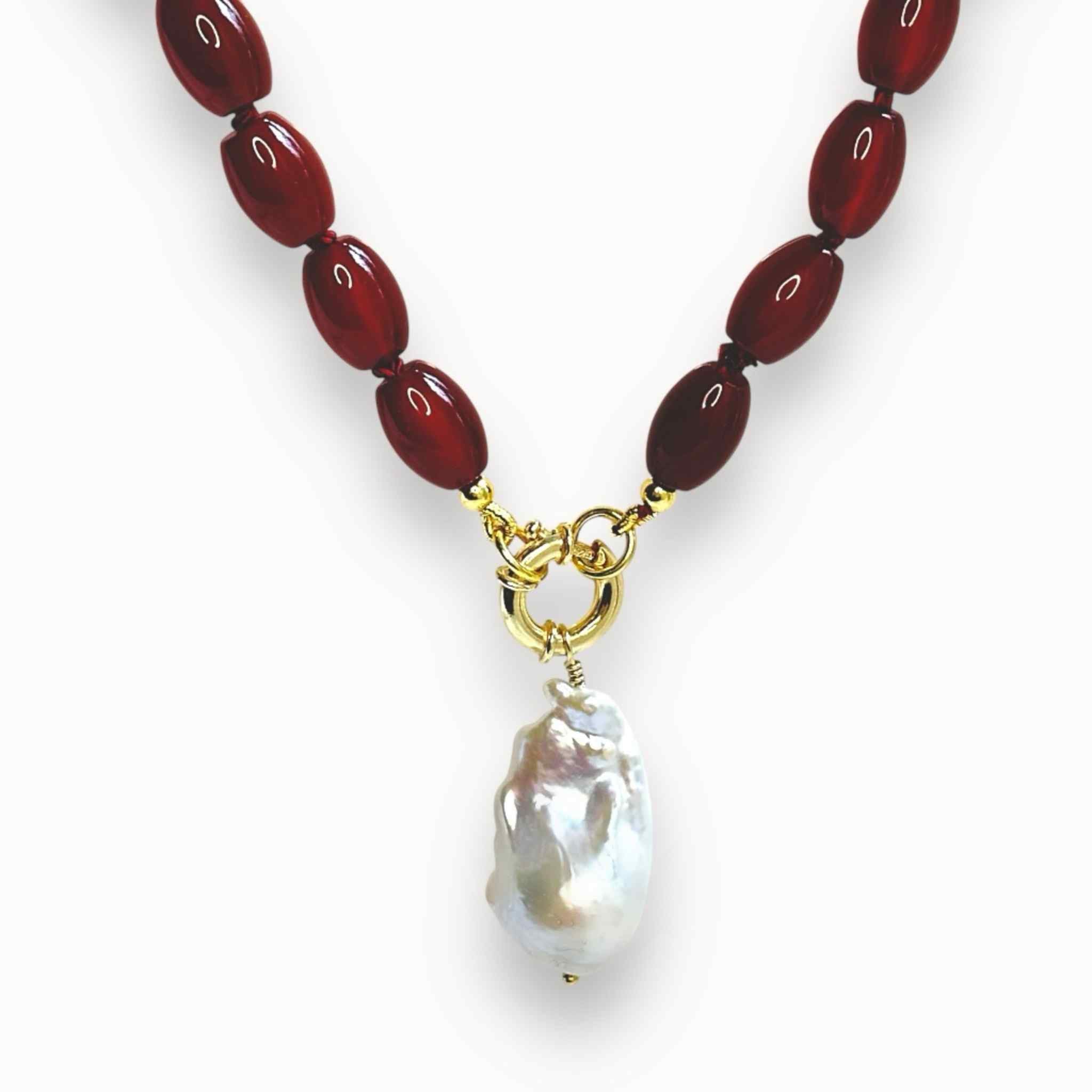 Red chunky gemstone beaded necklace with a large baroque pearl pendant