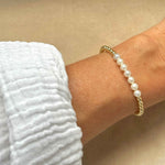 Gold beaded bracelet with cluster of pearls
