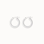 Pair of silver hoop earrings on a white background