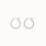 Pair of silver hoop earrings on a white background