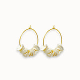 Pair of gold hoop earrings with freshwater petal pearls on a white background