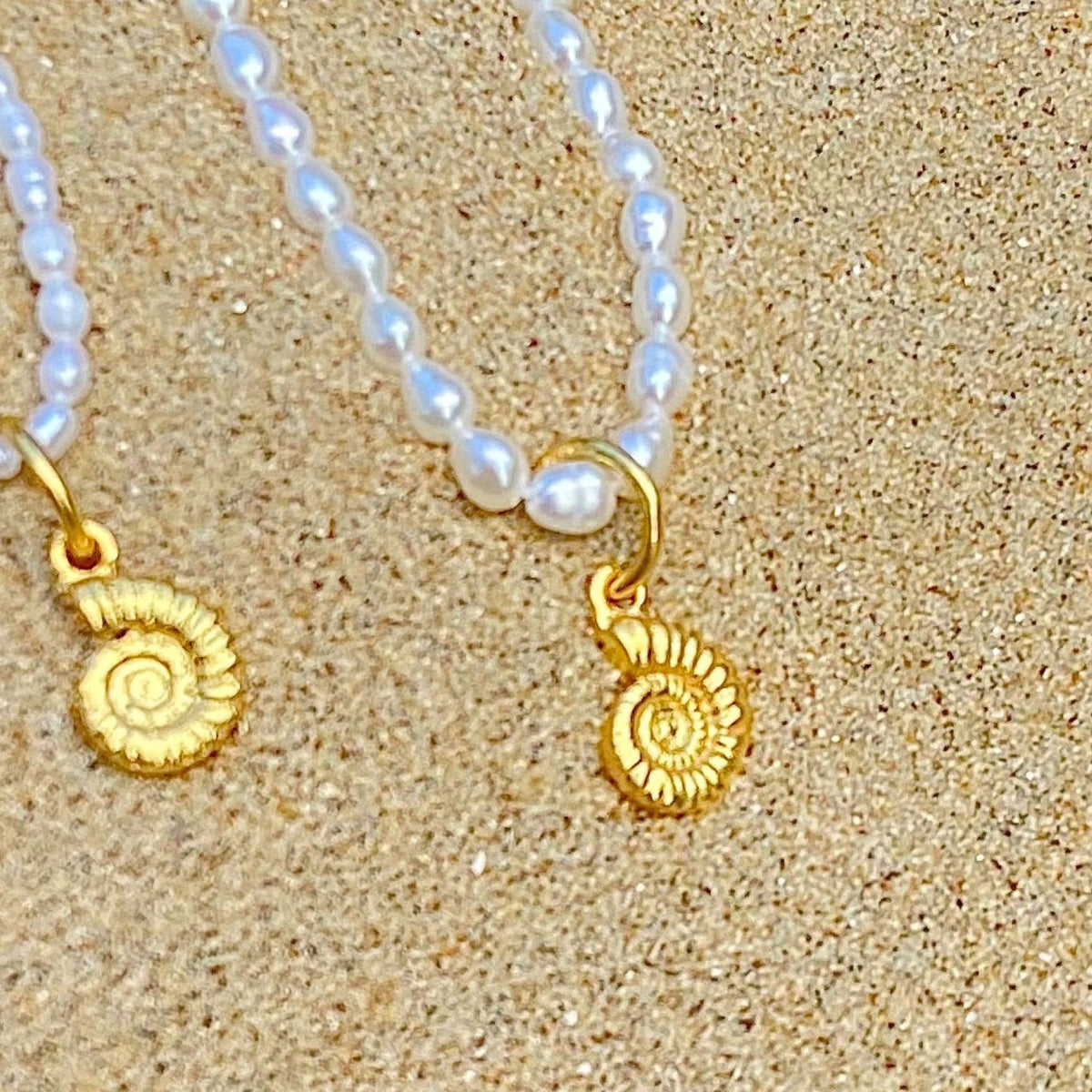 Ammonite charm in gold vermeil on small freshwater pearl necklace